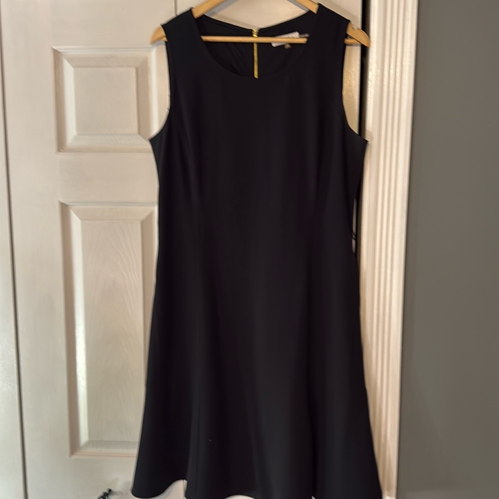 Black sleeveless zip up the back Calvin Klein dress.